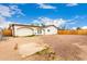 Large backyard featuring a sturdy wooden fence and potential for landscaping or outdoor activities at 3042 N 87Th Ave, Phoenix, AZ 85037