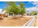 Attractive single-story home with lush trees providing shade and curb appeal at 3042 N 87Th Ave, Phoenix, AZ 85037