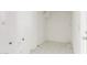 The laundry room features neutral paint and tile floor at 3042 N 87Th Ave, Phoenix, AZ 85037