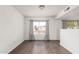 Open living room features hardwood floors, neutral walls and bright, natural light at 3042 N 87Th Ave, Phoenix, AZ 85037