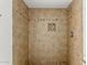 This tiled shower stall has a mosaic accent and tiled flooring at 3042 N 87Th Ave, Phoenix, AZ 85037