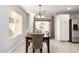 Dining area with a sliding glass door, stylish chairs, and natural light at 306 W Angus Rd, San Tan Valley, AZ 85143