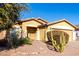 Inviting single-story home featuring a neutral-toned exterior with xeriscaping at 306 W Angus Rd, San Tan Valley, AZ 85143