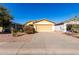 Inviting single-story home featuring a neutral-toned exterior, two car garage and low-maintenance desert landscaping at 306 W Angus Rd, San Tan Valley, AZ 85143