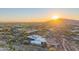 Scenic aerial view of a desert home at sunrise, highlighting the natural landscape at 30600 N Pima Rd # 19, Scottsdale, AZ 85266