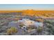 Elegant desert home boasting a circular driveway and serene desert landscaping at 30600 N Pima Rd # 19, Scottsdale, AZ 85266