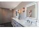 Modern bathroom with double vanity, backlit mirrors, and stylish fixtures at 30600 N Pima Rd # 19, Scottsdale, AZ 85266