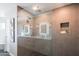 Elegant bathroom showcasing a glass shower, double vanity, and recessed lighting at 30600 N Pima Rd # 19, Scottsdale, AZ 85266