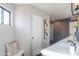 Well-lit bathroom features a quartz countertop vanity, art, and accent bench seating at 30600 N Pima Rd # 19, Scottsdale, AZ 85266