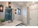 Modern bathroom featuring a white countertop, decorative lighting, and a sleek mirror with black trim at 30600 N Pima Rd # 19, Scottsdale, AZ 85266