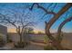 Tranquil courtyard with mature trees and tiled bench seating at 30600 N Pima Rd # 19, Scottsdale, AZ 85266