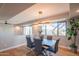 Dining area with modern chandelier, and views of the desert landscape through large windows at 30600 N Pima Rd # 19, Scottsdale, AZ 85266