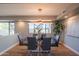 Dining room featuring a modern chandelier and large windows with views to the outside at 30600 N Pima Rd # 19, Scottsdale, AZ 85266