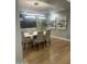 Bright dining room featuring modern lighting fixture, table, and hardwood floors at 30600 N Pima Rd # 19, Scottsdale, AZ 85266