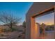 Charming entry gate with mature trees and desert landscaping at 30600 N Pima Rd # 19, Scottsdale, AZ 85266