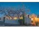 Home exterior with desert plants, stucco walls, and an inviting entryway with lighting at 30600 N Pima Rd # 19, Scottsdale, AZ 85266