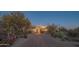 Home exterior with desert plants, stucco walls, and an inviting entryway with lighting at 30600 N Pima Rd # 19, Scottsdale, AZ 85266