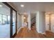 Hallway with access to patio, bedroom and stairwell with lots of natural light at 30600 N Pima Rd # 19, Scottsdale, AZ 85266