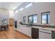 Modern kitchen featuring white cabinets, stainless steel appliances, and clerestory windows at 30600 N Pima Rd # 19, Scottsdale, AZ 85266