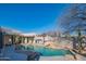 Gorgeous backyard pool featuring a rock waterfall, surrounded by desert landscaping and custom patio at 30600 N Pima Rd # 19, Scottsdale, AZ 85266