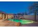 Backyard pool with waterfall feature and an outdoor kitchen under a trellis-covered eating area at 30600 N Pima Rd # 19, Scottsdale, AZ 85266