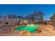 Custom pool features a rock waterfall, built-in BBQ, and a mature mesquite tree at 30600 N Pima Rd # 19, Scottsdale, AZ 85266