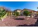 Backyard featuring low-maintenance xeriscape landscaping with various trees, cacti and gravel at 3650 W Denali Dr, Anthem, AZ 85086