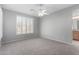 Bedroom with carpet, ceiling fan, and window with shutters at 3650 W Denali Dr, Anthem, AZ 85086