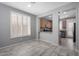 Bright dining area with tile flooring and shuttered windows that open to the kitchen at 3650 W Denali Dr, Anthem, AZ 85086