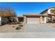 Charming single-story home featuring a tile roof, stone accents, desert landscaping, and a two-car garage at 3650 W Denali Dr, Anthem, AZ 85086