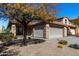 Charming home with desert landscaping, a tile roof, a two-car garage, and stone accents at 3650 W Denali Dr, Anthem, AZ 85086