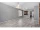 Bright living room with tile flooring, a ceiling fan, and access to the kitchen at 3650 W Denali Dr, Anthem, AZ 85086