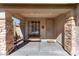 Inviting front porch with stone pillars, a bench, and a decorative security door at 3650 W Denali Dr, Anthem, AZ 85086