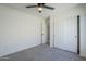 Neutral bedroom featuring carpet, a ceiling fan and a closet with sliding doors at 39237 N Acadia Way, Anthem, AZ 85086