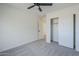 Neutral bedroom featuring carpet, a ceiling fan and a closet with sliding doors at 39237 N Acadia Way, Anthem, AZ 85086