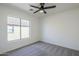 Bright bedroom with a ceiling fan and a window providing natural light at 39237 N Acadia Way, Anthem, AZ 85086