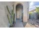 Covered entryway features desert landscaping with large cacti and a paved walkway to the front door at 39237 N Acadia Way, Anthem, AZ 85086