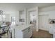 Open-concept kitchen featuring quartz countertops, stainless steel appliances, and an island with seating at 39237 N Acadia Way, Anthem, AZ 85086