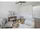 Living room boasts neutral walls, comfortable seating, and a side table with lamps at 39237 N Acadia Way, Anthem, AZ 85086