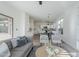 Open-concept living room flows into the kitchen and boasts neutral tones, modern decor, and abundant natural light at 39237 N Acadia Way, Anthem, AZ 85086