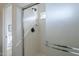 Close-up of the shower, featuring matte black fixtures and a built-in shower caddy at 39237 N Acadia Way, Anthem, AZ 85086