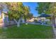 Outdoor lounge area in backyard with green lawn and lemon tree at 3931 E Glenrosa Ave, Phoenix, AZ 85018