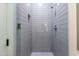 Modern bathroom shower featuring gray subway tile and glass door at 3931 E Glenrosa Ave, Phoenix, AZ 85018