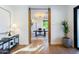 Hallway view of a bright home office with a desk, modern lighting, and stylish decor at 3931 E Glenrosa Ave, Phoenix, AZ 85018