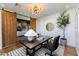 Bright home office with wooden sliding doors, modern chandelier, desk, and an elegant indoor tree at 3931 E Glenrosa Ave, Phoenix, AZ 85018