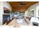 Expansive living room with hardwood floors, a fireplace, and an open floor plan connecting to the kitchen at 3931 E Glenrosa Ave, Phoenix, AZ 85018