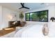 Bright main bedroom featuring a large window, wooden floors, and a modern ceiling fan at 3931 E Glenrosa Ave, Phoenix, AZ 85018