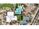 Overhead aerial view showing the community pool, tennis courts, clubhouse, and meticulously designed landscaping and parking at 3935 E Rough Rider Rd # 1055, Phoenix, AZ 85050