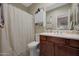 Bathroom featuring a shower-tub combination, single sink vanity and modern design at 3935 E Rough Rider Rd # 1055, Phoenix, AZ 85050