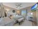 Inviting main bedroom featuring a decorative ceiling fan, vanity, and plush decor at 3935 E Rough Rider Rd # 1055, Phoenix, AZ 85050